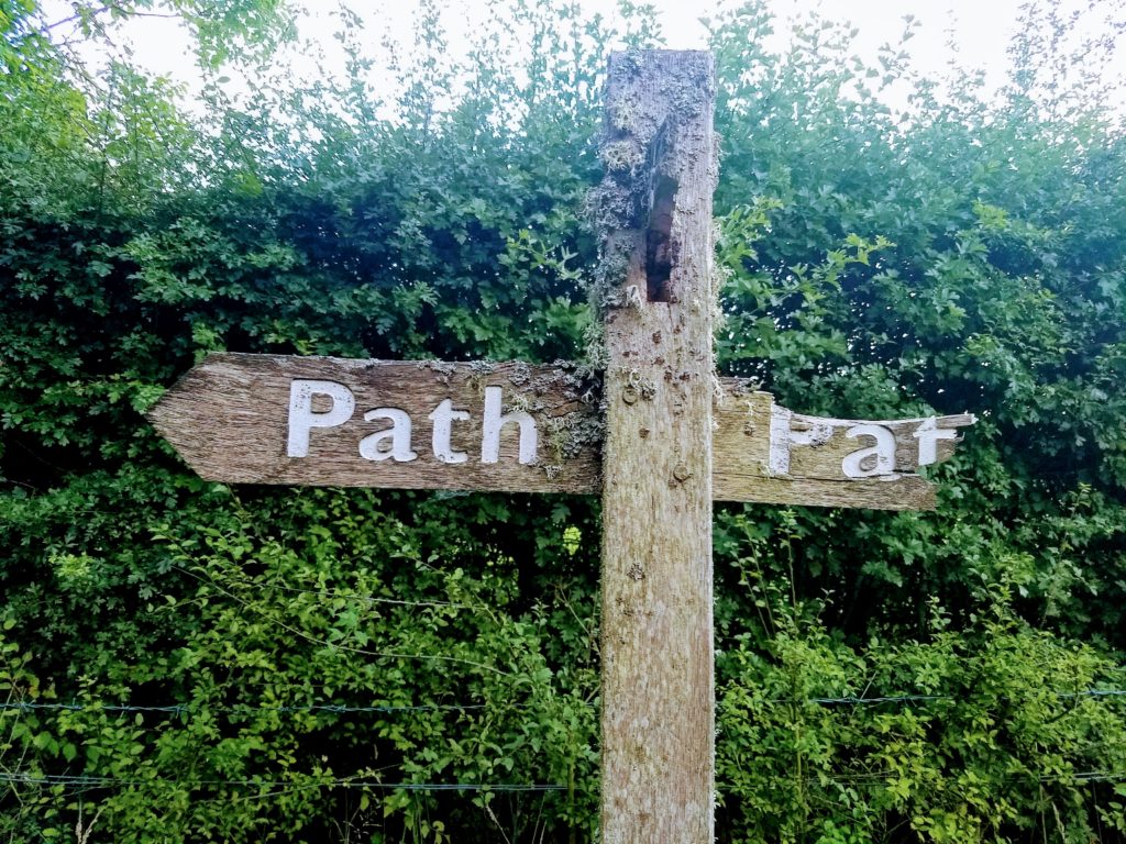 sign indicating a path to the left and to the right